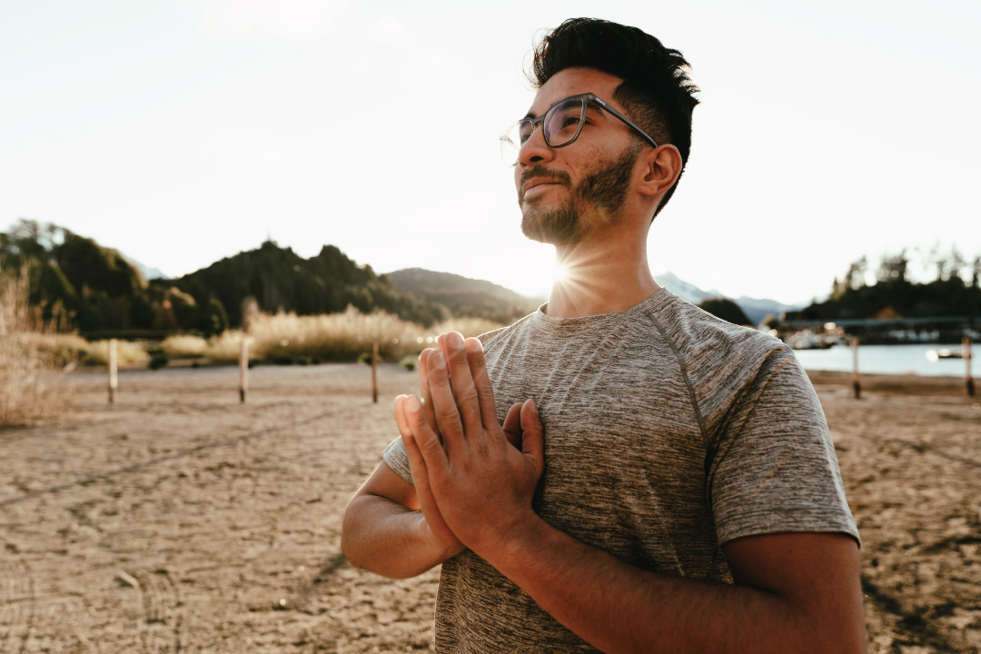 young adult male in prayer