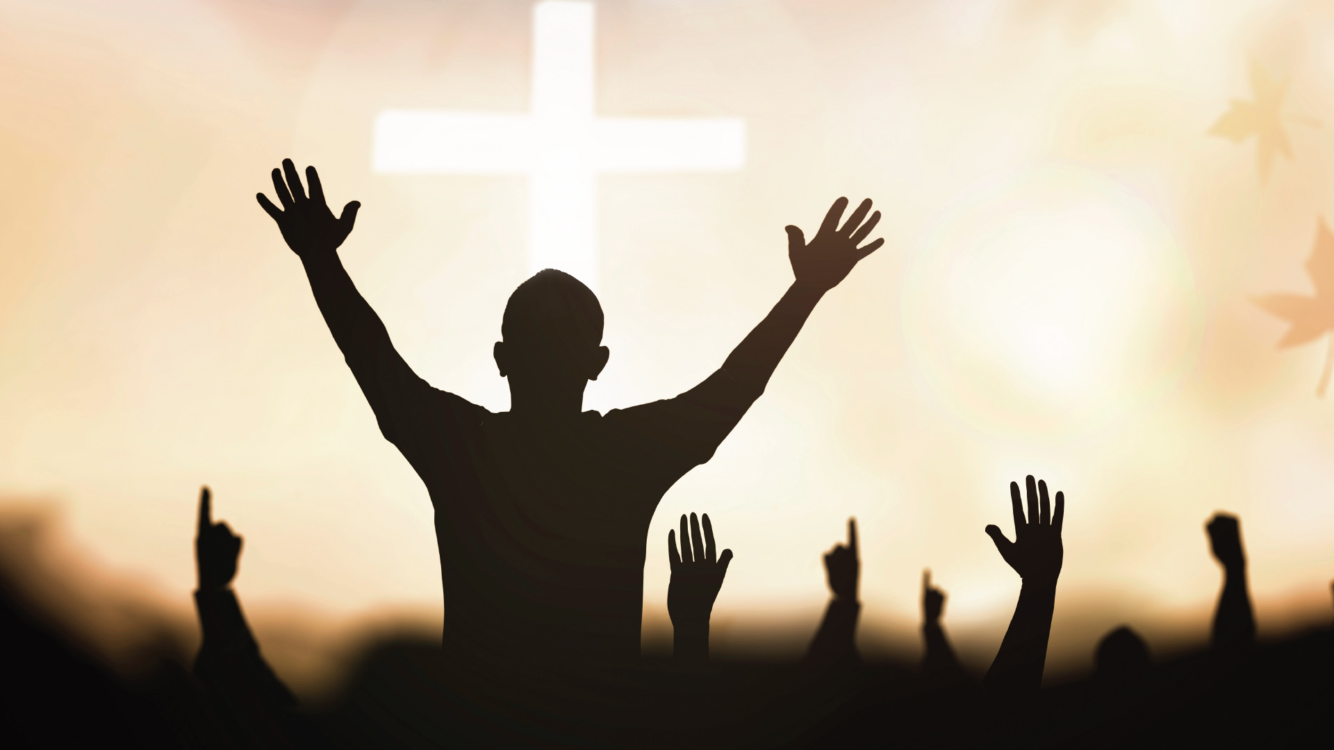 People with their hands up as a symbol of surrender in worship